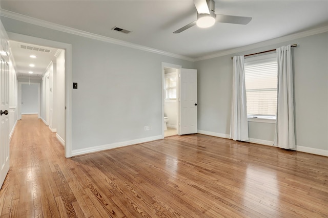 empty room featuring crown molding, ceiling fan, and light hardwood / wood-style floors