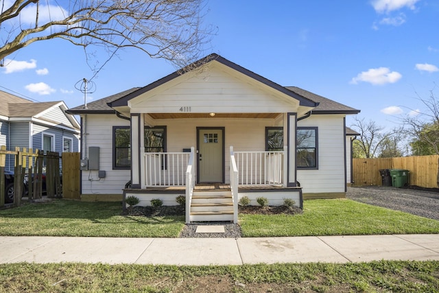 bungalow-style house with covered porch and a front yard