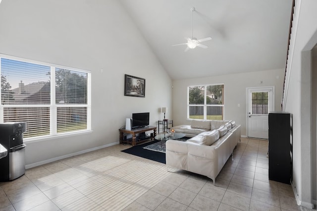 living room with ceiling fan, high vaulted ceiling, and light tile patterned floors