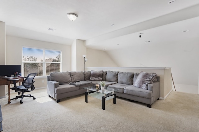 carpeted living room with lofted ceiling