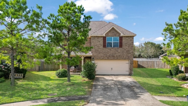 view of front of home featuring a garage and a front yard