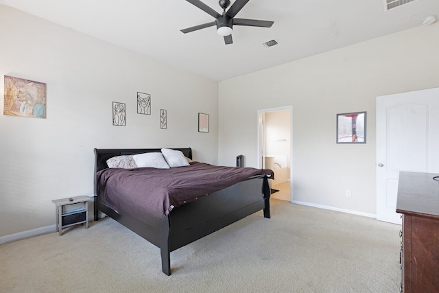 bedroom with ensuite bath, ceiling fan, and light colored carpet