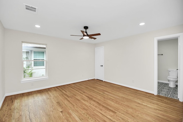 spare room with ceiling fan and light hardwood / wood-style floors