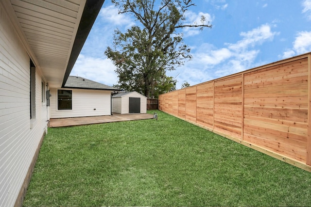 view of yard featuring a storage shed and a patio area