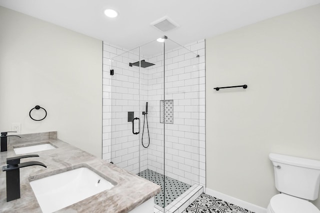 bathroom featuring tile patterned floors, vanity, toilet, and an enclosed shower