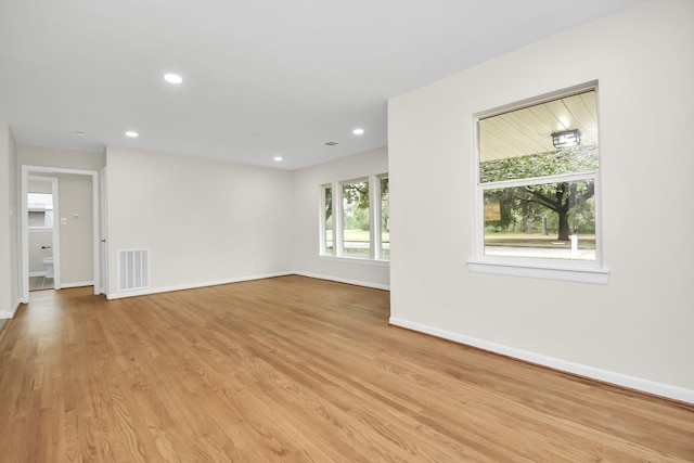 unfurnished room featuring light hardwood / wood-style floors