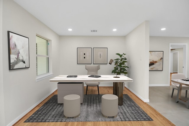 home office with hardwood / wood-style floors