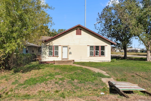 back of house with a yard