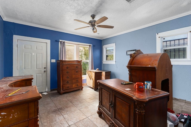 office area featuring light tile patterned floors, a textured ceiling, ceiling fan, and crown molding