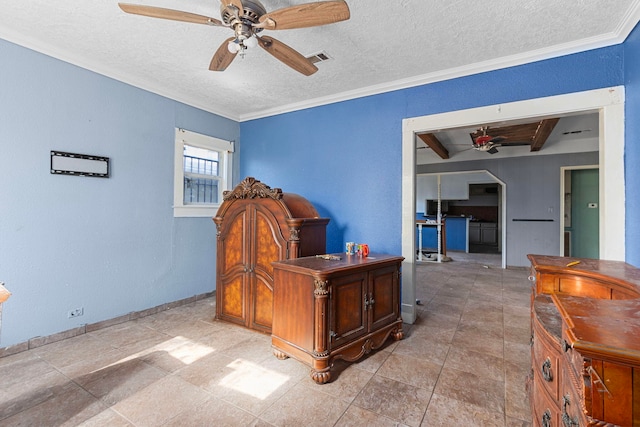 tiled office space featuring ceiling fan, ornamental molding, and a textured ceiling