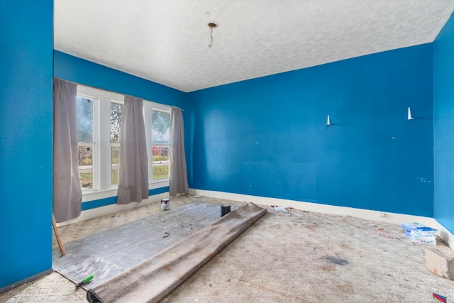 empty room with a textured ceiling