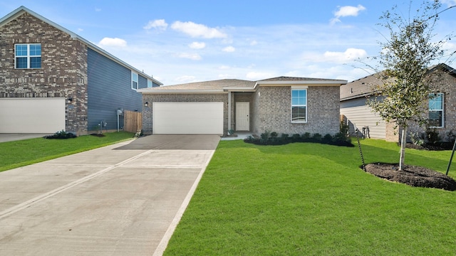 view of front of house with a garage and a front lawn