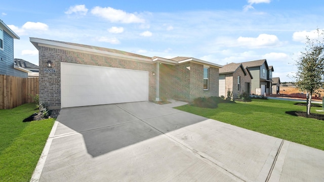 view of front of property featuring a garage and a front yard