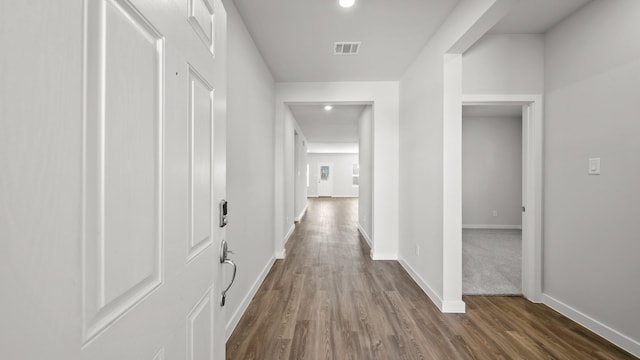 hallway featuring dark hardwood / wood-style floors