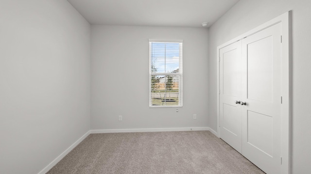 unfurnished bedroom with light carpet