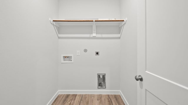 laundry area featuring hookup for a washing machine, hardwood / wood-style floors, gas dryer hookup, and hookup for an electric dryer