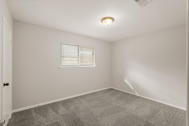 spare room featuring carpet floors