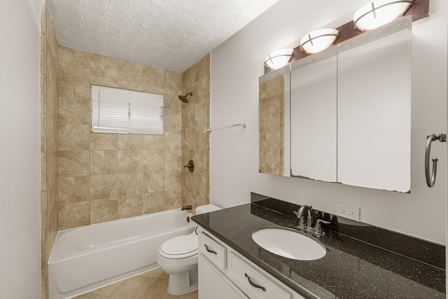 full bathroom featuring tile patterned floors, a textured ceiling, vanity, toilet, and tiled shower / bath