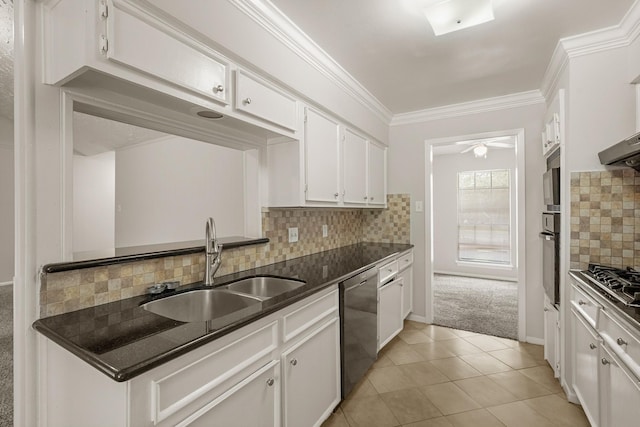 kitchen featuring decorative backsplash, white cabinetry, stainless steel appliances, and light tile patterned floors