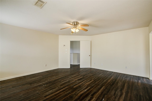 unfurnished room featuring dark hardwood / wood-style flooring and ceiling fan