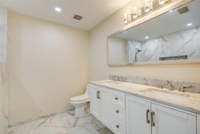 bathroom featuring vanity, toilet, and walk in shower