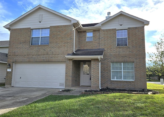 view of front property featuring a garage and a front yard