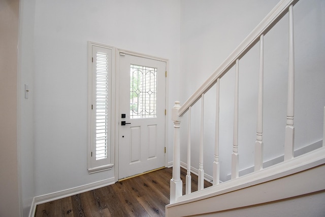 entryway with dark wood-type flooring