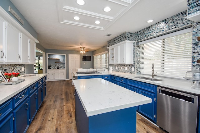 kitchen featuring a wealth of natural light, white cabinetry, dishwasher, and blue cabinets