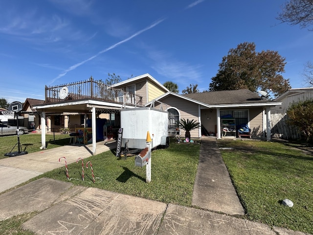 bungalow with a front yard, a balcony, and a carport