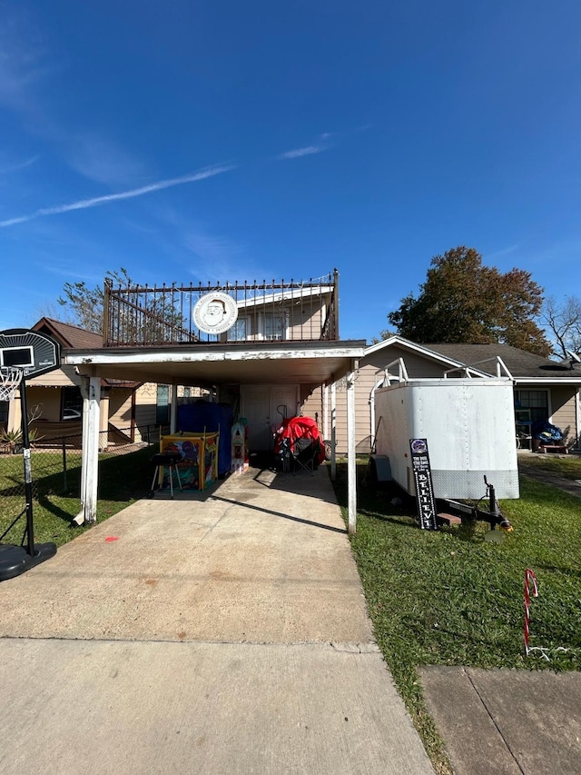 exterior space featuring a yard and a carport