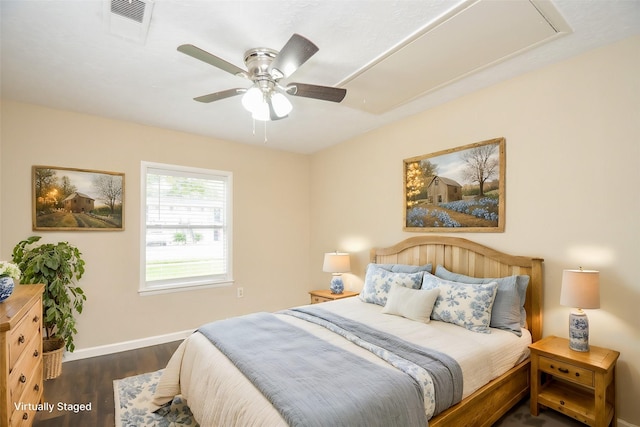 bedroom with ceiling fan and dark hardwood / wood-style flooring