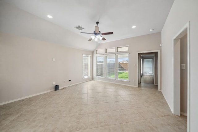 tiled spare room with ceiling fan and lofted ceiling