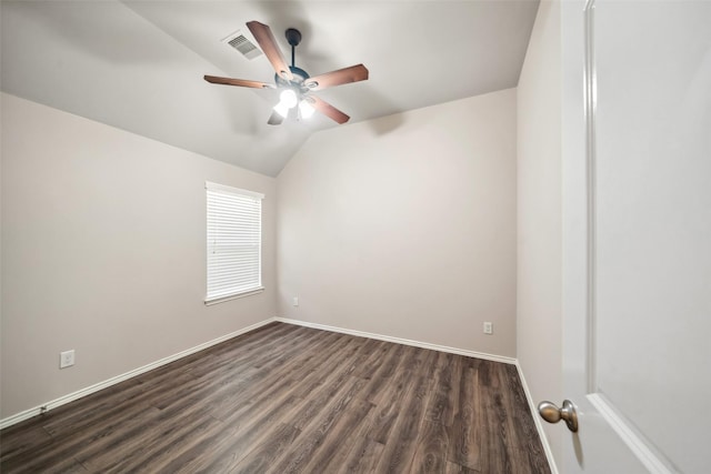 spare room with ceiling fan, dark wood-type flooring, and lofted ceiling