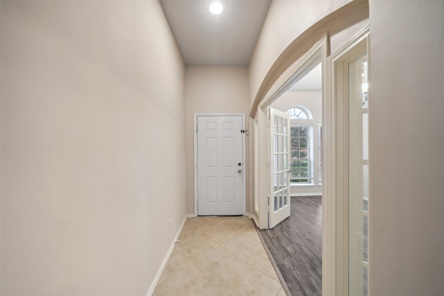 corridor with light hardwood / wood-style flooring