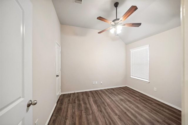 spare room with dark hardwood / wood-style flooring, ceiling fan, and lofted ceiling