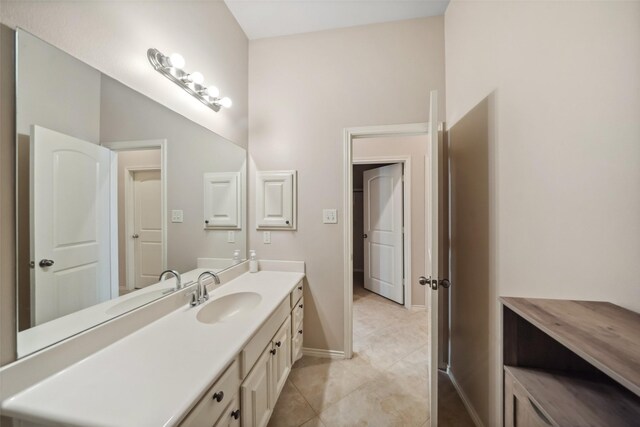 bathroom with tile patterned flooring and vanity