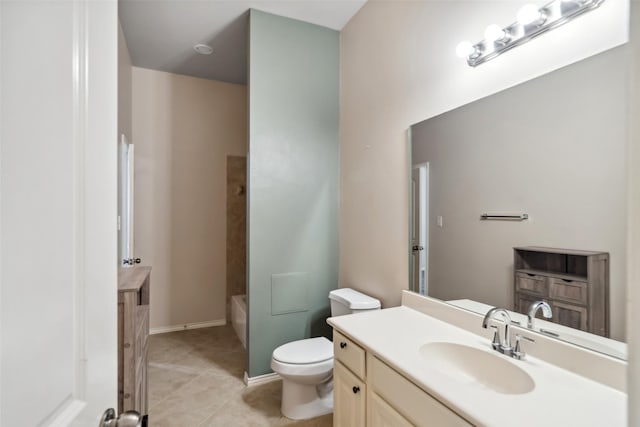 bathroom featuring tile patterned flooring, vanity, and toilet