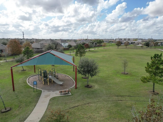 view of community featuring a yard and a playground