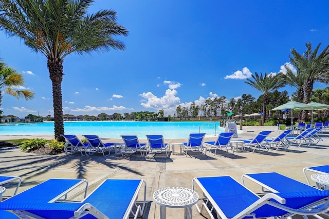 view of pool featuring a water view