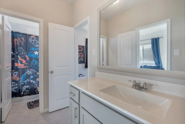 bathroom featuring tile patterned flooring and vanity