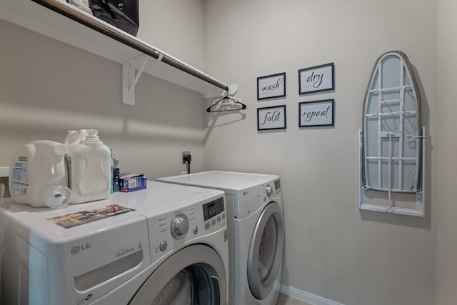 clothes washing area with independent washer and dryer