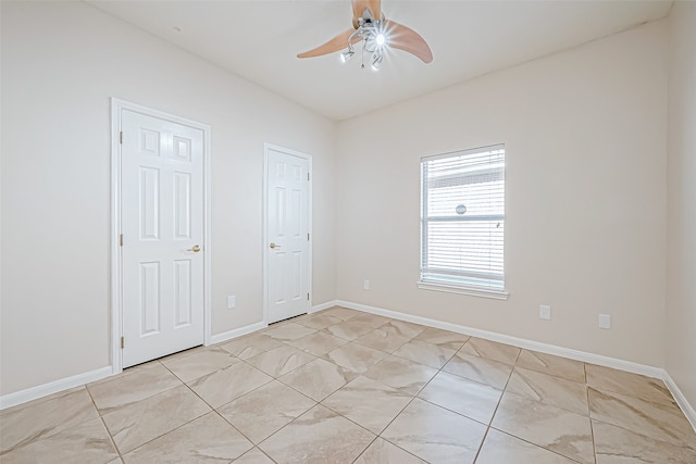 unfurnished bedroom featuring ceiling fan