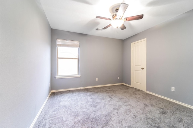 carpeted empty room with ceiling fan