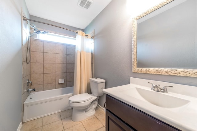 full bathroom with tile patterned flooring, shower / tub combo, vanity, and toilet