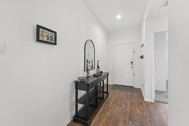 entrance foyer featuring dark wood-type flooring, recessed lighting, visible vents, and baseboards