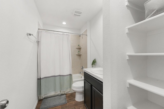 full bathroom with shower / tub combo, toilet, vanity, and hardwood / wood-style flooring