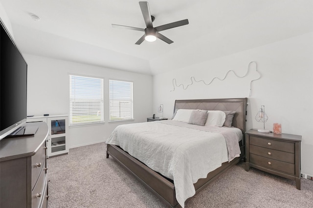 carpeted bedroom with lofted ceiling and ceiling fan