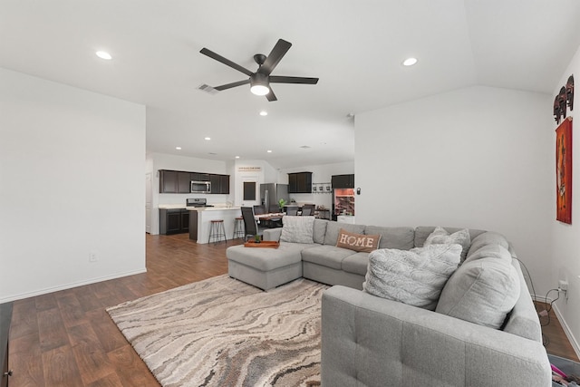 living room featuring ceiling fan, recessed lighting, visible vents, vaulted ceiling, and dark wood-style floors