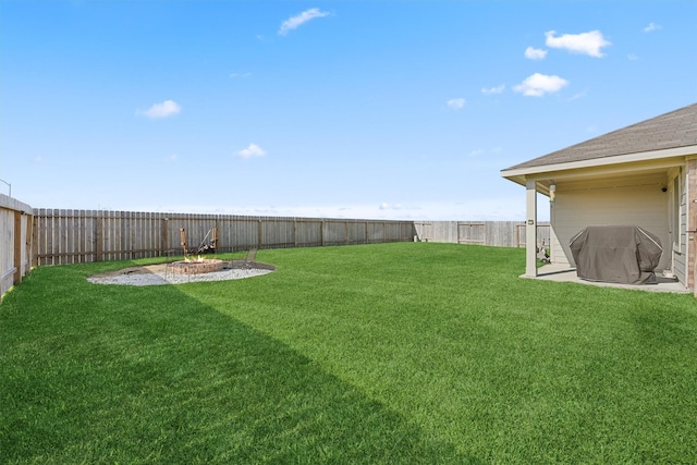 view of yard with a fenced backyard