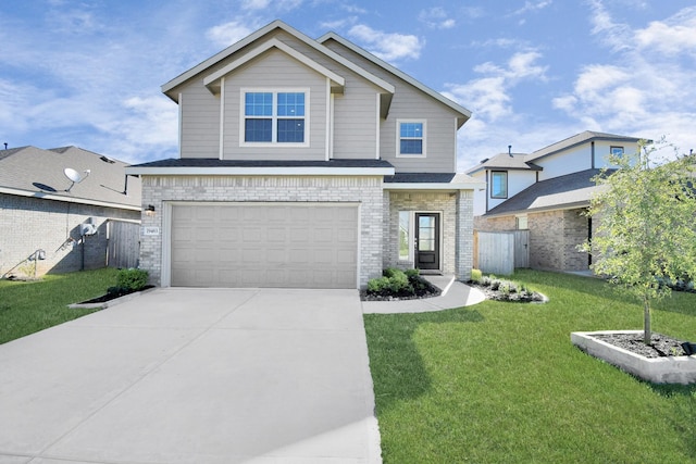 view of front of property featuring a garage and a front lawn